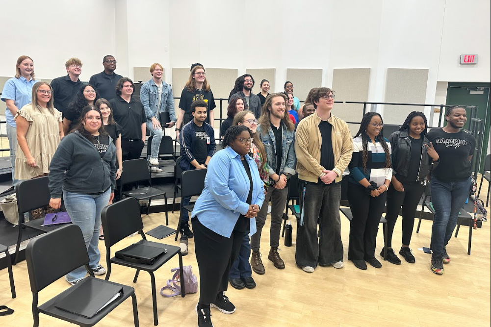 Students and directors gathered in a rehearsal room at regional auditions